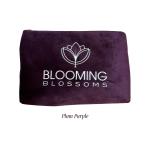 Plum purple velvet pouch with Blooming Blossoms logo