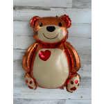 Foil teddy bear balloon with a red heart on its chest