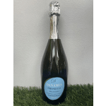 Bottle of Danamia Prosecco standing on grass