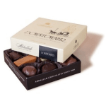 Box of assorted chocolates with a lid partially open