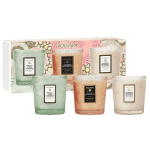 Set of three scented candles in textured glass jars with a decorative box