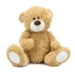 Tan teddy bear plush toy sitting upright