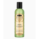 Green bottle of sensual massage oil with a cream label and black cap