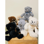 Assorted plush teddy bears in black, brown, gray, and white