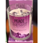 Purple crystal candle in a glass container