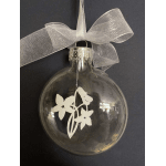 Clear glass ornament with a silver bow and white floral design