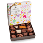Box of assorted chocolates in a heart-patterned gift box