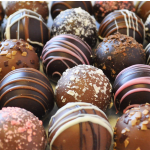 Assorted chocolate truffles with drizzled and sprinkled toppings