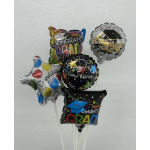 Cluster of graduation-themed foil balloons against a plain wall