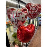 Heart-shaped balloons with "I Love You" and "Love You More" text