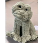 Gray plush dog toy sitting upright on a pale background