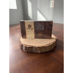 Box of chocolates on a wood slice display