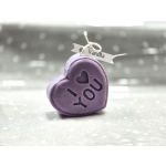Purple heart-shaped candle with an "I ♥ You" design and Vanilla tag