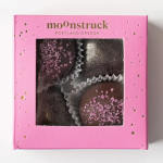 Pink box of chocolate truffles with glittery toppings