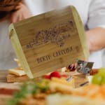 Wooden cheese board engraved with North Carolina map and text