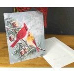 Holiday card with two cardinals on a snowy pine branch
