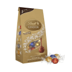 Box of assorted Lindt Lindor chocolates with wrapped truffles beside it