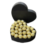Heart-shaped box filled with gold-wrapped chocolates