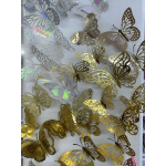 Decorative metallic butterfly cutouts in gold, silver, and white
