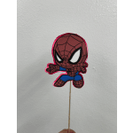 Spider-Man cutout on a wooden stick against a plain wall