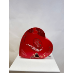 Heart-shaped red Lindor chocolate box with gold heart accents