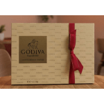 Godiva assorted chocolate gift box with a red ribbon