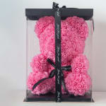 Pink rose teddy bear in a clear gift box with black ribbon