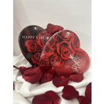 Red rose petals with heart-shaped Valentine cards