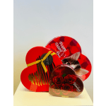 Heart-shaped gift boxes with chocolates and red roses