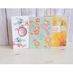 Three floral greeting cards with colorful spring designs and messages