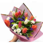 Bouquet of multicolored tulips with purple and white filler flowers