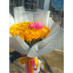 Handheld bouquet of yellow roses with a single pink gerbera wrapped in white paper with pink and yellow ribbons.