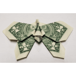 Dollar bill folded into a butterfly shape on a plain background