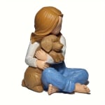 Figurine of a girl hugging a dog