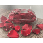 Clear plastic box filled with red rose petals on a table