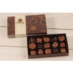 Box of assorted chocolates with the lid open beside it