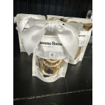 Three packaged simmer blend sachets tied with ribbon