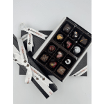 Box of assorted chocolates with decorative ribbons