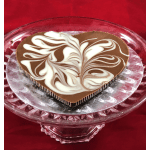 Heart-shaped chocolate dessert on a glass pedestal stand