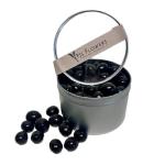 A gray tin bucket filled with black decorative stones