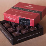 Box of sea salt caramels in a red and black gift box