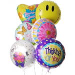 Cluster of colorful foil balloons with smiley and floral designs