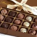 Box of assorted chocolates with a ribbon bow