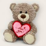 Plush teddy bear holding a heart with "Love you" text