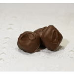 Three chocolate truffles on a white surface
