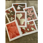 Five Valentine-themed greeting cards with hearts, chocolates, and pink roses