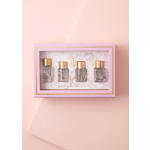 Pink gift box with four small perfume bottles inside