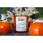 Orange candle in a glass jar with fruit-shaped decor