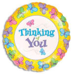 Round 'Thinking of You' foil balloon with colorful butterflies on a yellow border