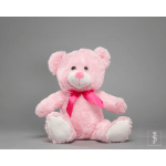 Pink teddy bear with a satin ribbon on a gray background